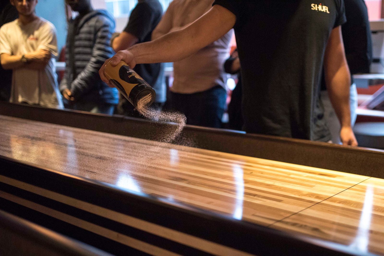 Close-up of scoring zones on two shuffleboard tables