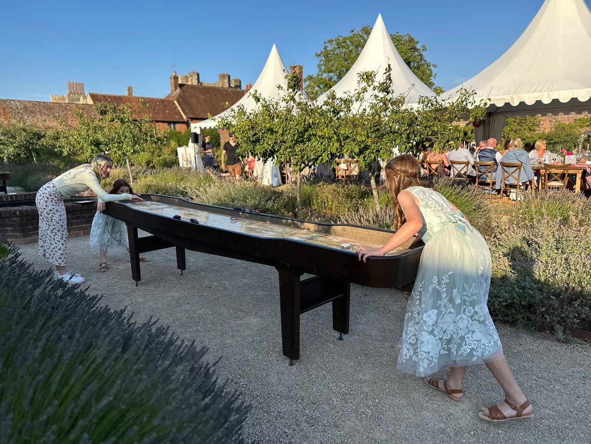 Shuffleboard set up at an outdoor garden event