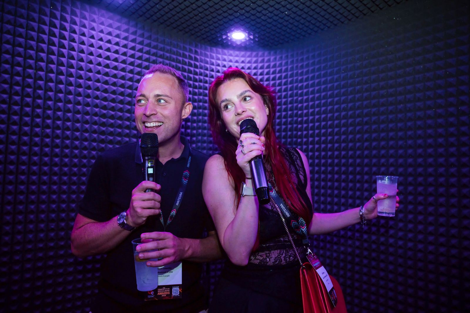 Two guests singing inside a soundproof SingPods pod